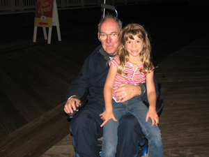 Riding with Grandpa on his scooter at Disney Boardwalk